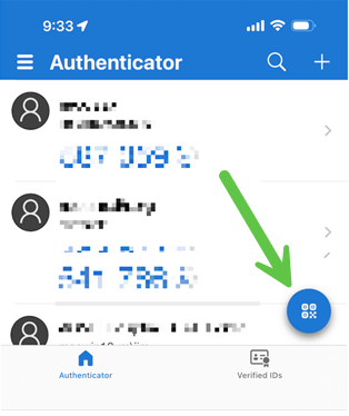 Authenticator app dashboard. Arrow indicating to select the qr code circle icon in the bottom right of the screen.